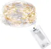 A coiled string of LED lights with a battery pack. Voir les images du produit