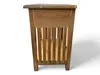 A side view of a wooden nightstand with a slatted design. Náhľad obrázku produktu