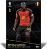 A soccer player in uniform on a dark, patterned background. Produktbild-Vorschau
