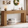 A console table with decorative items and a pouf in a room with white paneled walls. Anteprima dell’immagine prodotto