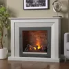 A fireplace with a glass door and stone interior, set in a living room with a plant and artwork. Anteprima dell’immagine prodotto