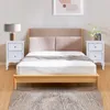 A bedroom scene with a bed, two nightstands, and a rug. Produktbild-Vorschau