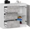 A white cabinet with concrete-effect drawer fronts and doors, showing its interior with some books and shelves. Produktbild-Vorschau