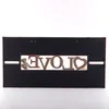 A decorative metal sign with the word 'LOVE' cut out, featuring two small hearts. Náhľad obrázku produktu