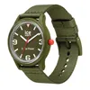 A close-up studio shot of a green analog watch with a fabric strap. Voir les images du produit
