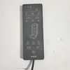 A dark gray Beurer massage cushion remote control is shown against a light gray background. Voir les images du produit