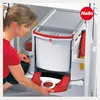A woman is using a cleaning set with a dustpan and brush. Produktbild-Vorschau
