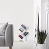 A modern living room with a grey sofa, a white tree-shaped bookshelf filled with books, and a tall mirror. Náhľad obrázku produktu