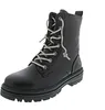A black lace-up boot on a white background. Voir les images du produit