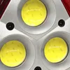 Close-up view of the LED lights and mounting screws of a warning triangle. Voir les images du produit