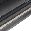 A close-up view of a vacuum sealer machine, showing a warning label. Podgląd zdjęcia produktu