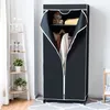 A black fabric wardrobe with a white zipper is open, revealing clothes hanging inside and a stuffed toy on a shelf. Podgląd zdjęcia produktu