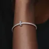 A close-up shot of a silver Pandora charm bracelet with a single charm on a person's arm. Produktbild-Vorschau