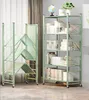 Two green shelving units are shown in a room with a window and curtains in the background. One unit is folded and the other is open and filled with books. Produktbild-Vorschau