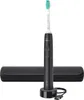 A black electric toothbrush with its charging base and travel case, presented on a white background. Produktbild-Vorschau