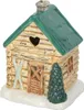 A ceramic oil burner shaped like a log cabin. Voir les images du produit