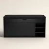 A black shoe cabinet with a padded seat on top, shown against a plain light gray background. Náhľad obrázku produktu