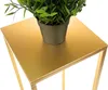 A close-up of a gold plant stand with a potted plant on top. Anteprima dell’immagine prodotto