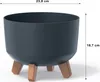 A dark gray planter pot with three wooden legs, shown against a white background with dimensions indicated by text and lines. Podgląd zdjęcia produktu