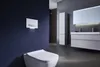 A modern bathroom with a wall-mounted toilet and a vanity. Anteprima dell’immagine prodotto