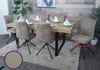 A dining room setting with a wooden table and chairs. Voir les images du produit