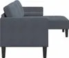 A side view of a dark gray sofa with a chaise lounge extension. Produktbild-Vorschau