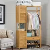 A bamboo wardrobe and closet unit with clothes hanging and items stored on shelves. Náhled obrázku produktu