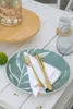 A table setting with a plate, cutlery, and a drink. Anteprima dell’immagine prodotto