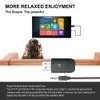 A person wearing headphones is sitting on a couch, with a TV screen and a Bluetooth adapter shown. Produktbild-Vorschau