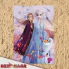 A blanket with Frozen characters on a sandy background. Produktbild-Vorschau