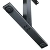 Close-up view of the underside of a black metal desk leg with adjustable feet. Anteprima dell’immagine prodotto