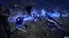 A group of characters in a dark, grassy field engaged in combat with glowing blue magical effects. Produktbild-Vorschau