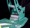 A close-up shot of a green scooter's deck and part of its folding mechanism. Náhľad obrázku produktu