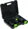 A black and green cordless drill with two batteries and a charger, all neatly arranged inside an open black carrying case. Podgląd zdjęcia produktu
