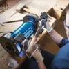 A person is using a Scheppach grinder to sharpen a tool. Náhľad obrázku produktu