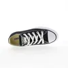 A single black Converse All Star shoe is shown from a top-down perspective against a white background. Voir les images du produit