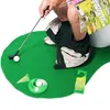 A person is playing golf on a toilet. Produktbild-Vorschau
