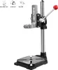 A drill stand with technical specifications shown in diagrams at the top. Náhľad obrázku produktu