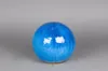 A blue ceramic ball on a gray background. Produktbild-Vorschau