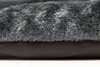 A close-up view of a dark gray dog blanket or cushion, showing the texture of the faux fur and the underlying fabric. Produktbild-Vorschau