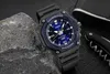 A Casio watch is placed on a rock next to a corkscrew and a wallet. Voir les images du produit