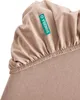 A close-up of a taupe fitted sheet with a green label. Produktbild-Vorschau