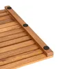 Close-up view of the corner of a wooden slatted mat with black rubber feet. Produktbild-Vorschau