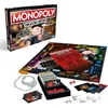 A Monopoly Cheaters Edition board game is displayed with its box and game components. Náhled obrázku produktu