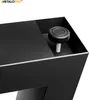 A close-up view of a black metal table leg with an adjustable foot. Anteprima dell’immagine prodotto