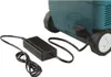 A black power adapter and its cord are connected to a teal and black portable cooler/heater. Produktbild-Vorschau