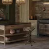 A rustic kitchen scene featuring a wooden island and a vintage-style bar stool. Náhľad obrázku produktu