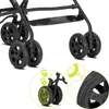 Close-up view of the wheels and locking mechanism of a stroller. Produktbild-Vorschau