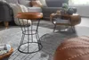 A living room scene with a sofa, coffee table, and a stool. Produktbild-Vorschau