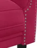 A close-up view of the side of a red velvet sofa, showing the studded trim. Produktbild-Vorschau